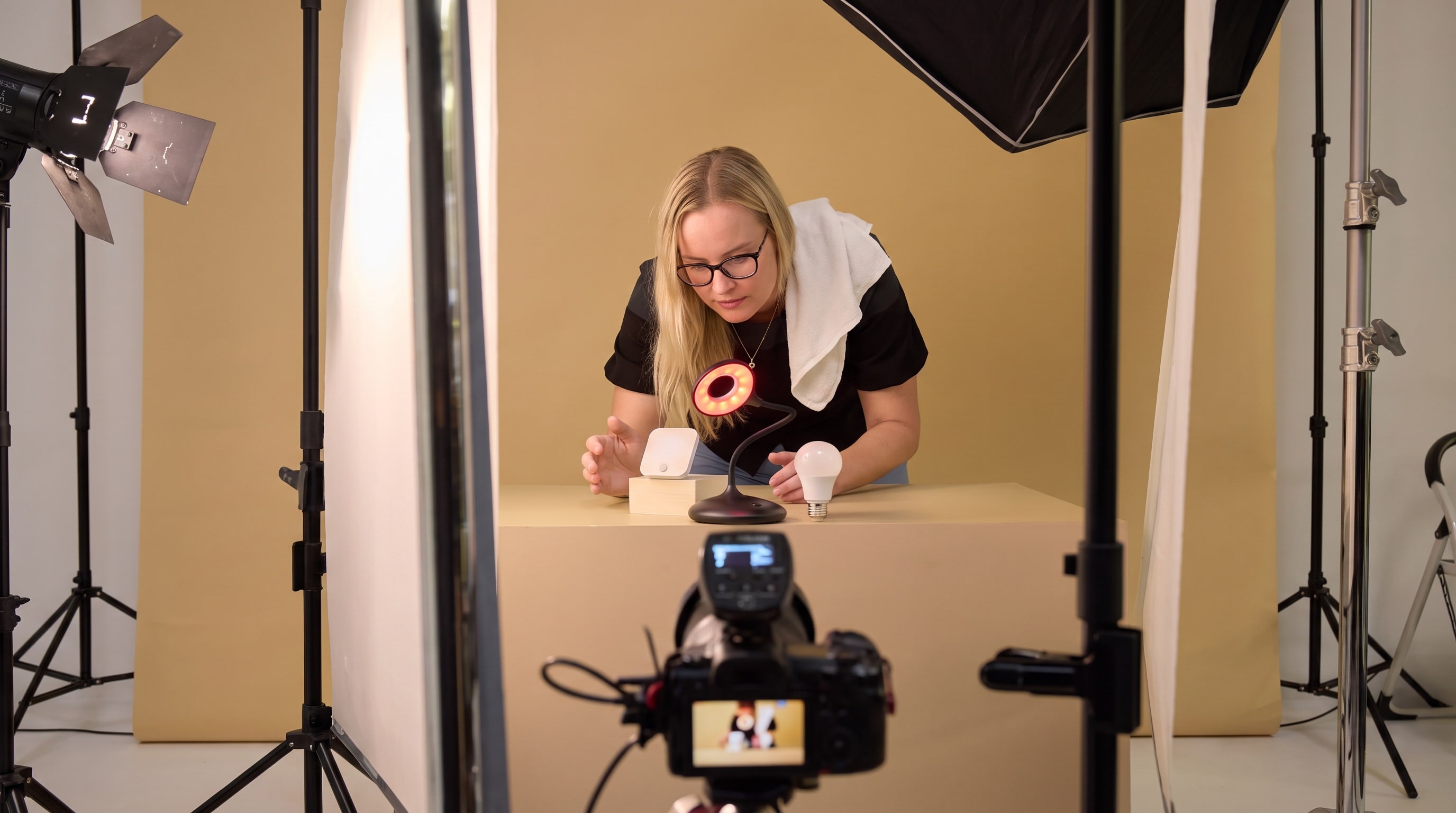 A Flapen photographer lining up a product shot on set in the Dubai studio