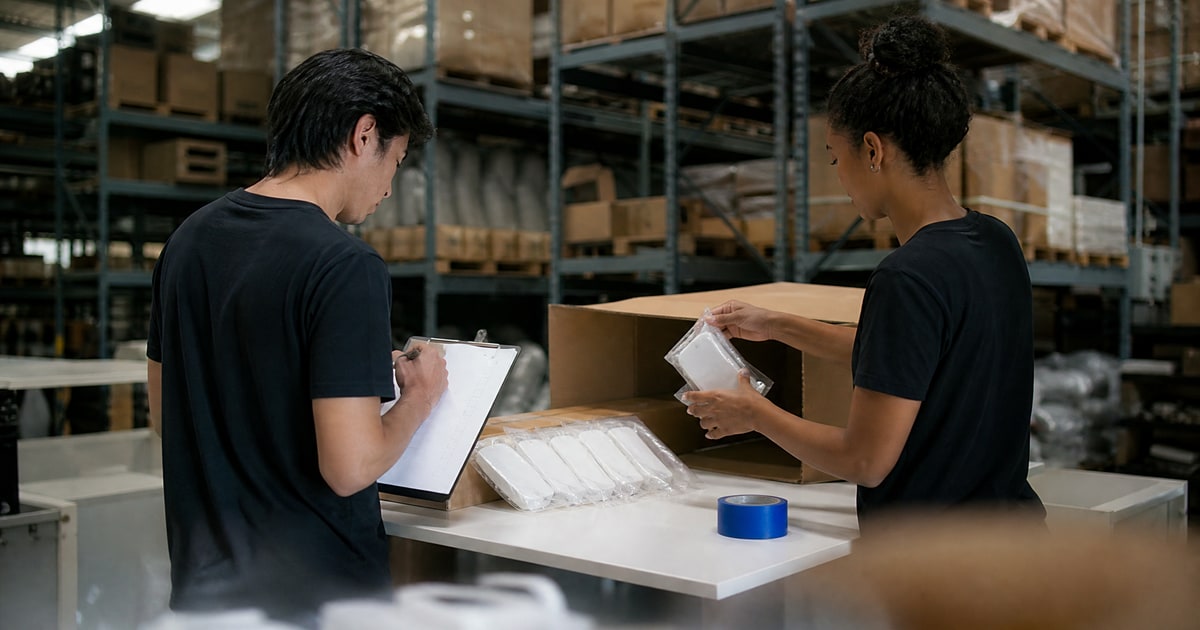 Flapen cover for Case studies for scaling revenue on Amazon: Flapen operators unpacking a supplier carton at the QC bench