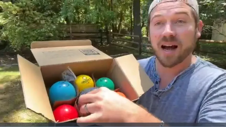 Unboxing the six-ball set outdoors