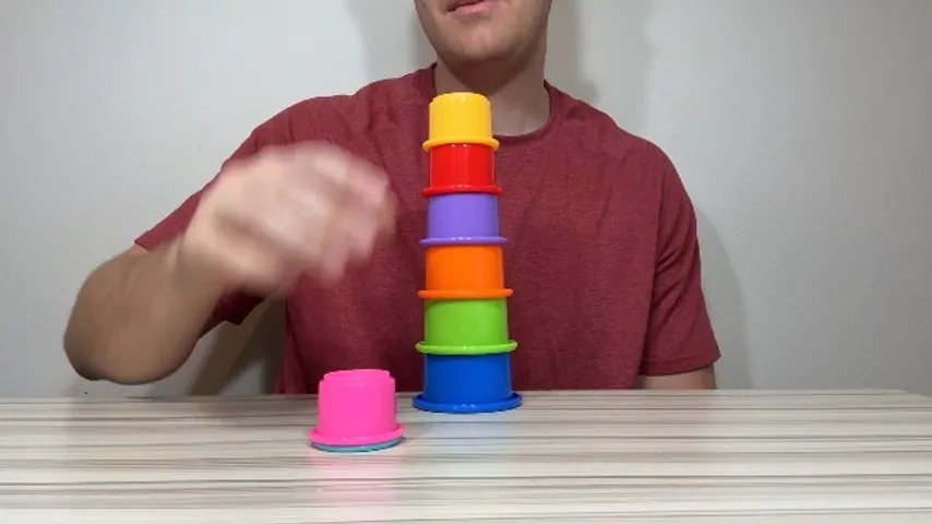 The rainbow cup tower mid-stack on a table