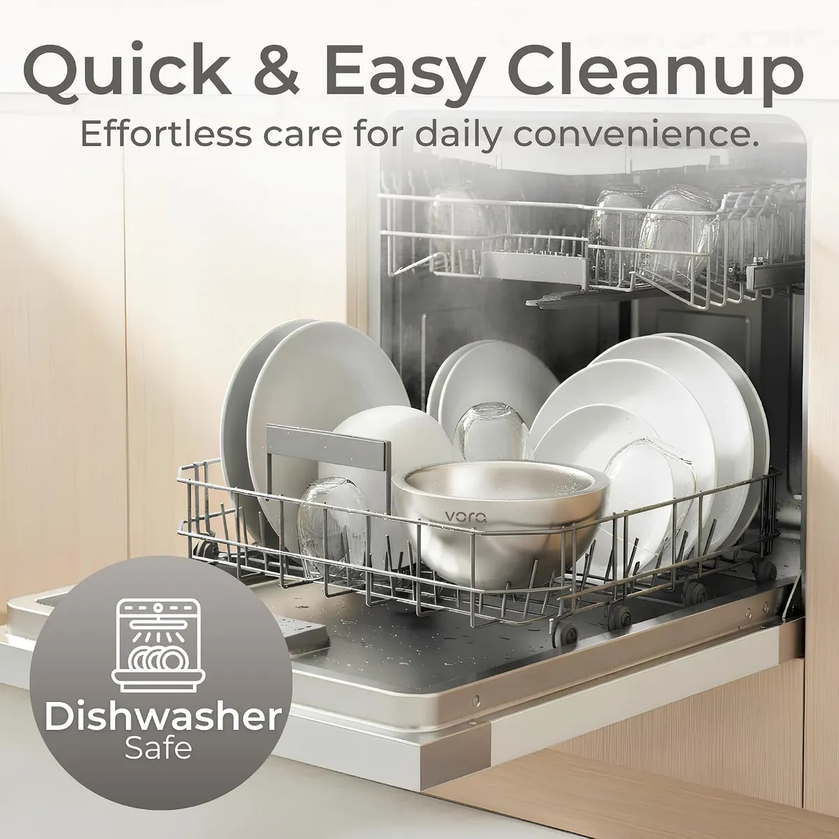 Stainless Vora bowl loaded in an open dishwasher rack among white plates and glasses